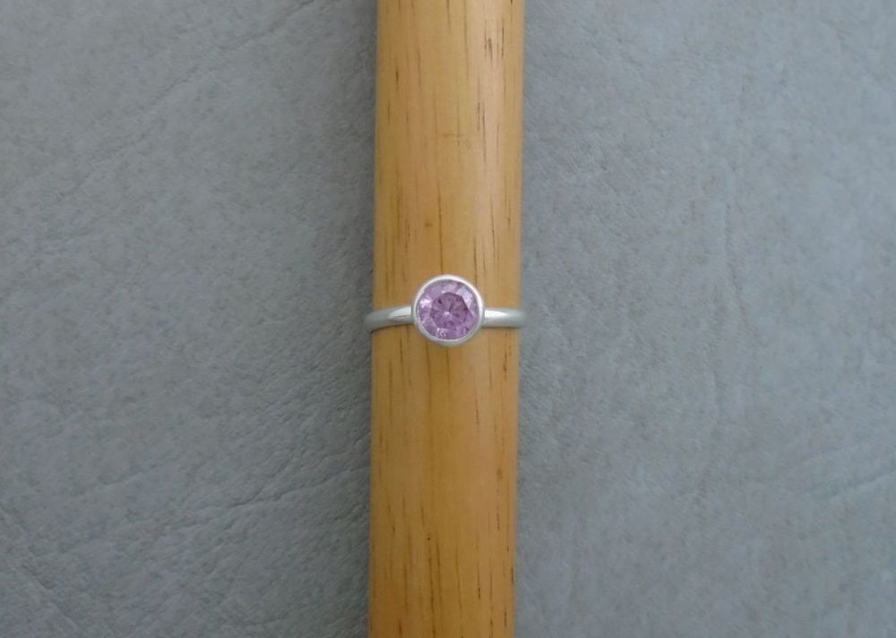 Proud set sterling silver & pink solitaire ring