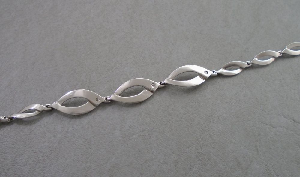 Sterling silver bracelet with 3 tiny diamonds