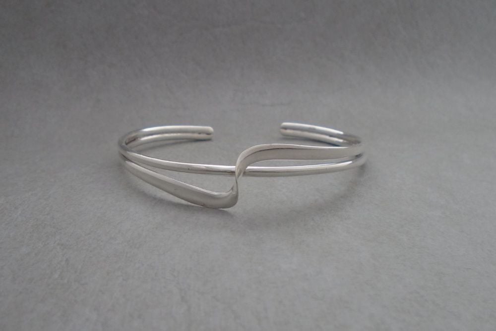 Double stranded sterling silver cuff with a twist