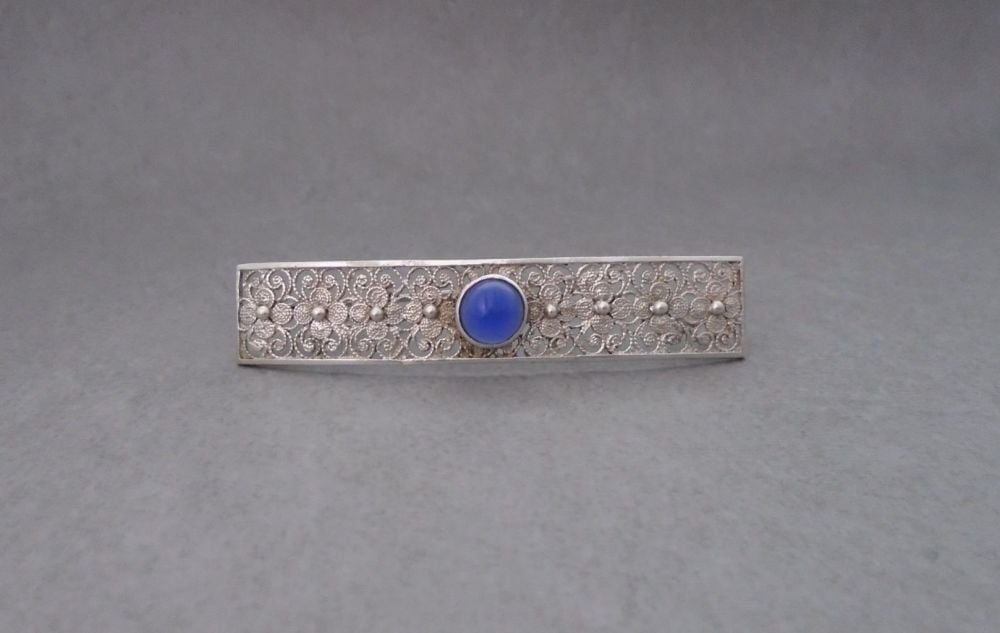 Vintage 835 silver filigree bar brooch with blue glass