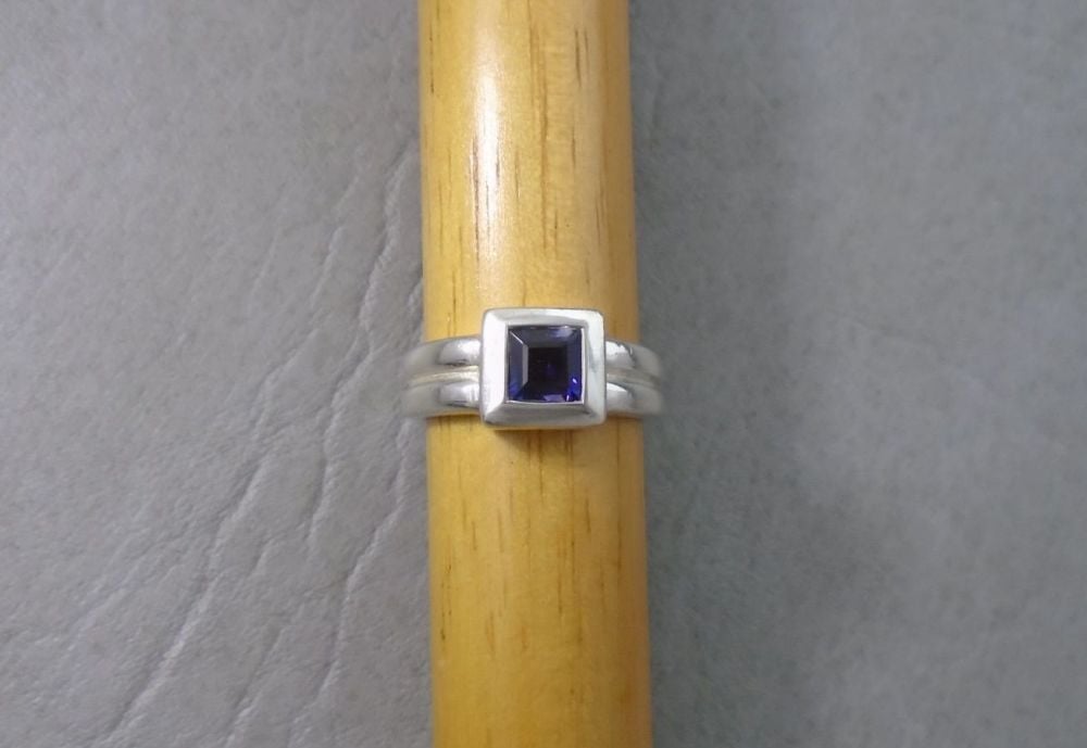 Sterling silver square set purple glass ring