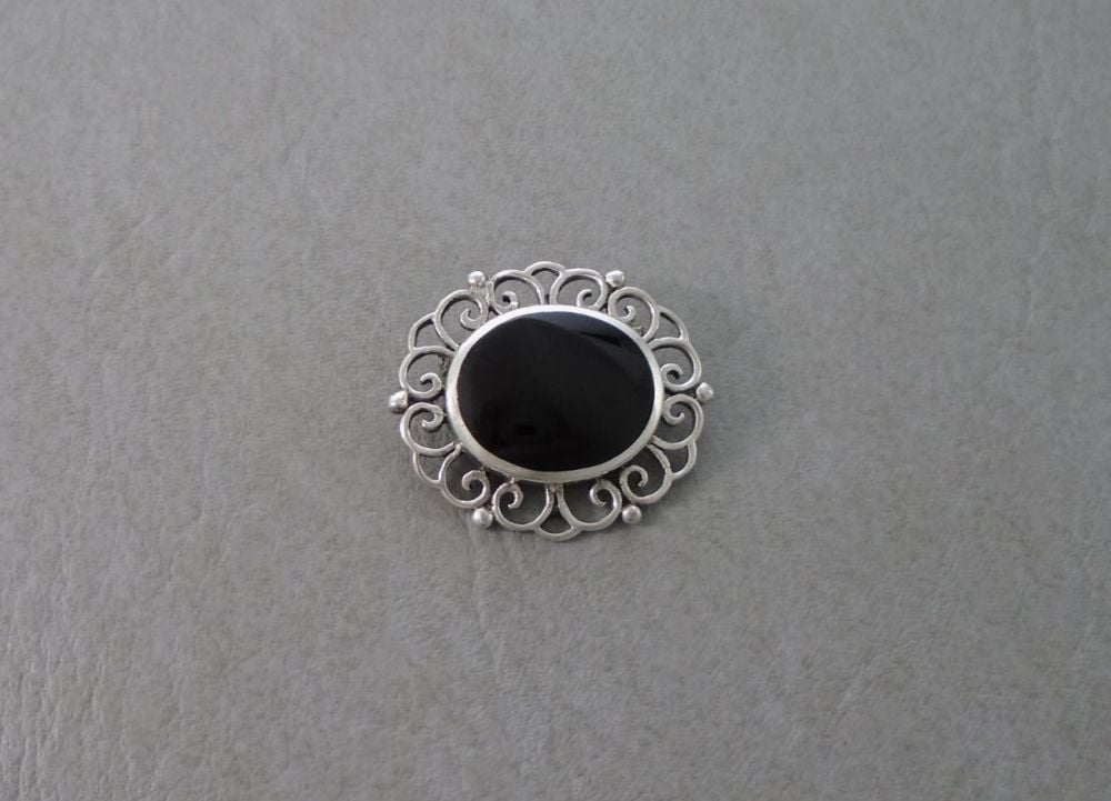 Sterling silver framed black onyx brooch