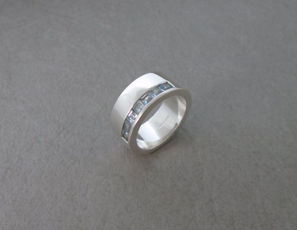 Solid thick set sterling silver & topaz ring