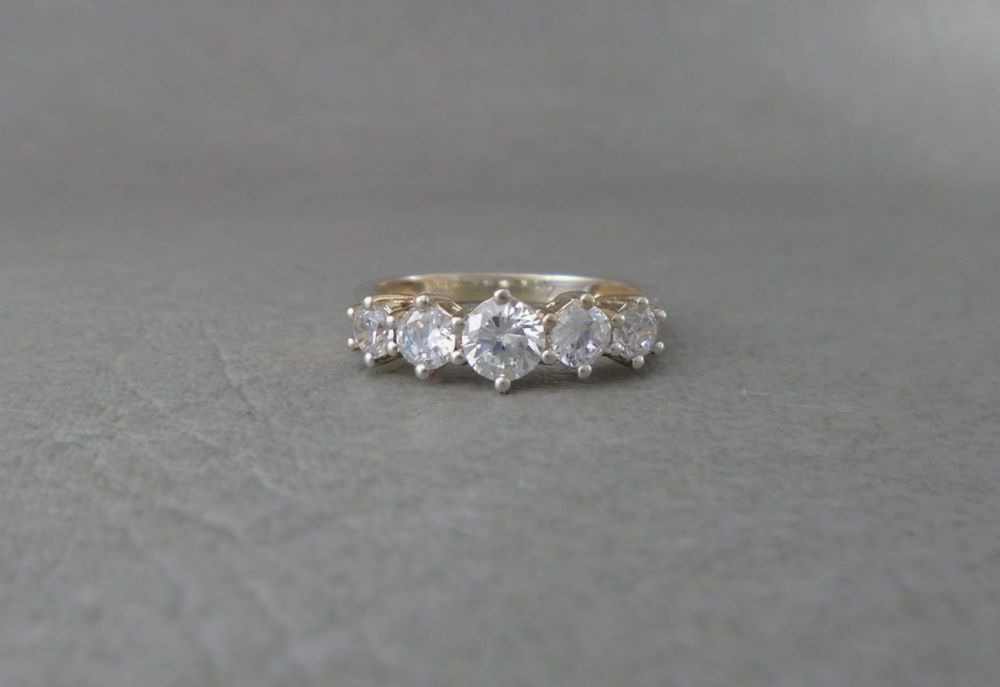 Gilt sterling silver ring with graduated stones