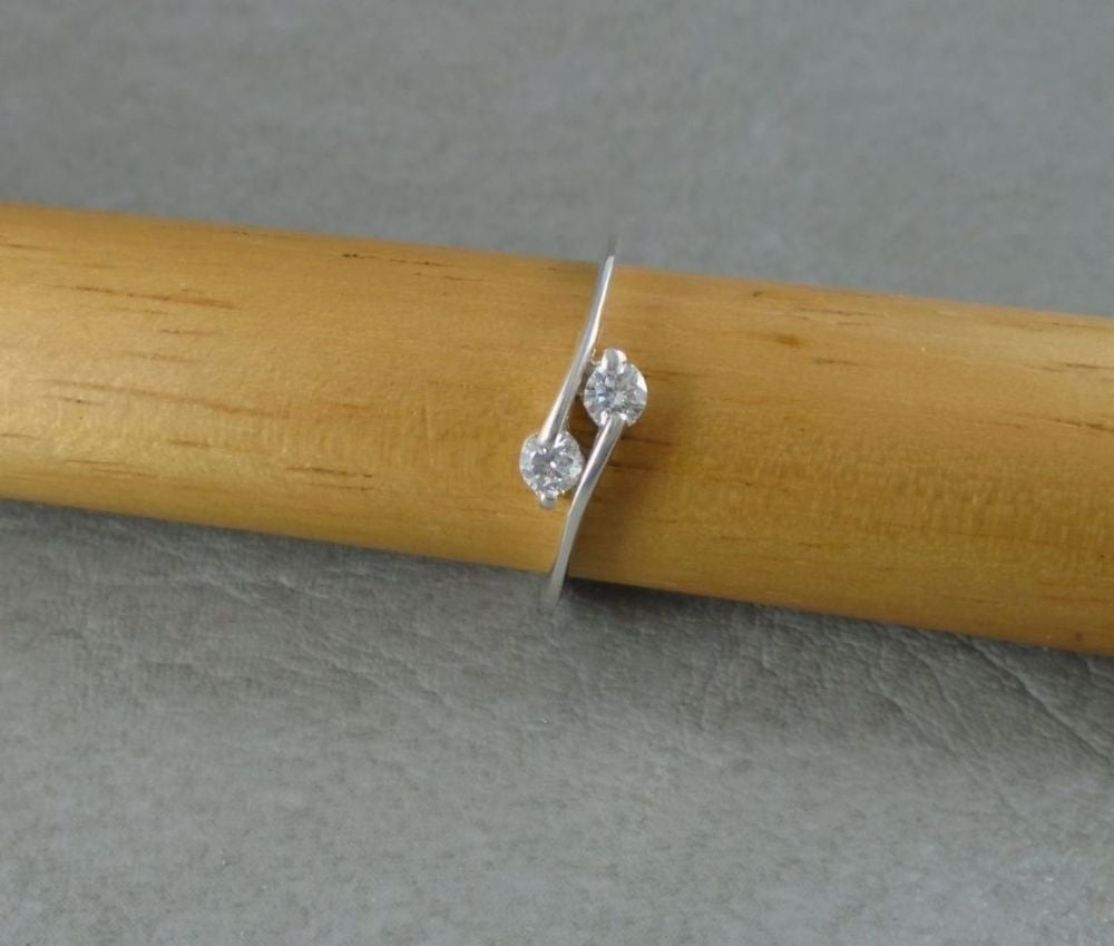 Slim sterling silver clear stone bypass ring