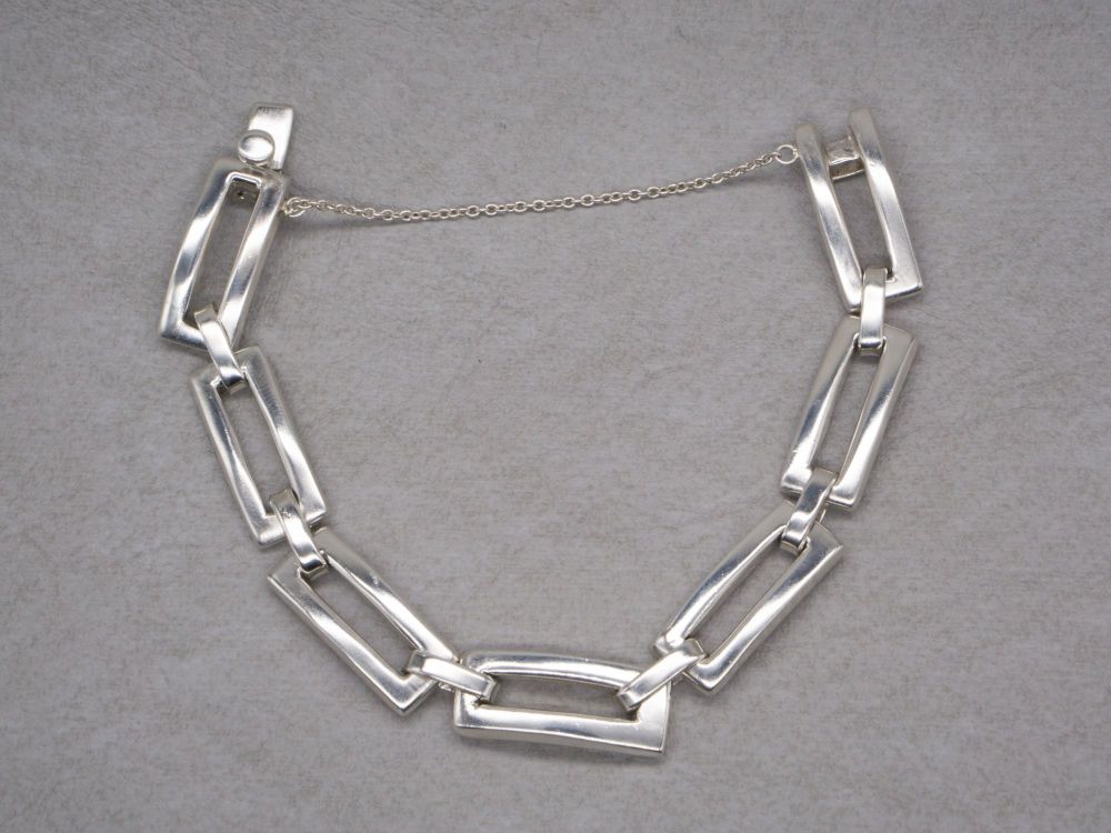 Chunky open rectangular panel bracelet with safety