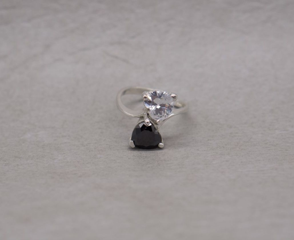 Sterling silver bypass ring with black & clear heart stones