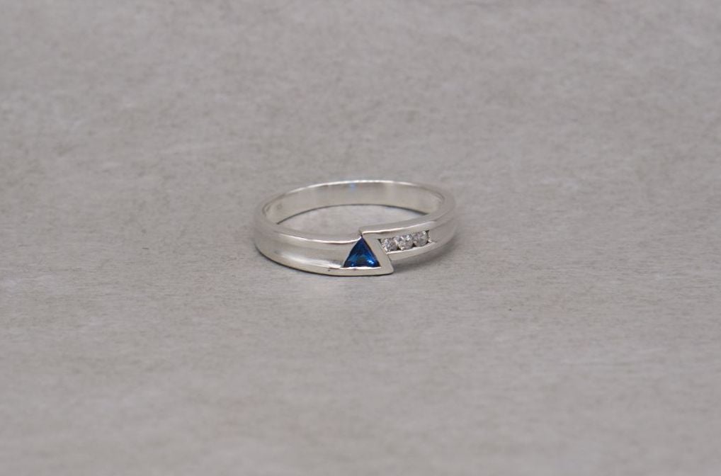 Unusual sterling silver ring with a blue triangle stone