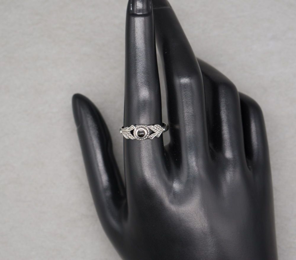 Sterling silver & black onyx ring with fancy leaf shoulders