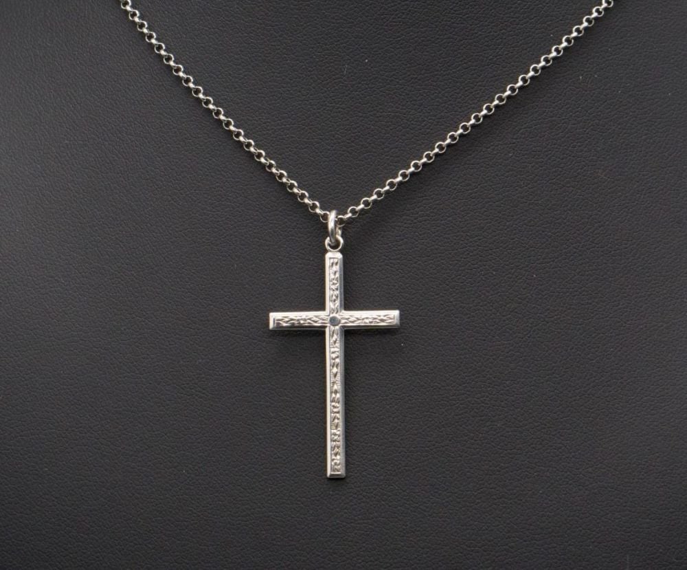 Vintage sterling silver necklace with a floral engraved cross