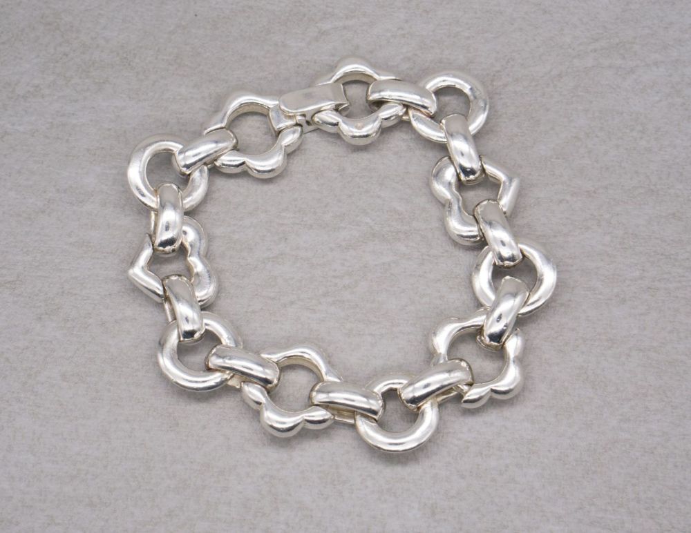 Heavy sterling silver hearts, flowers & circles bracelet