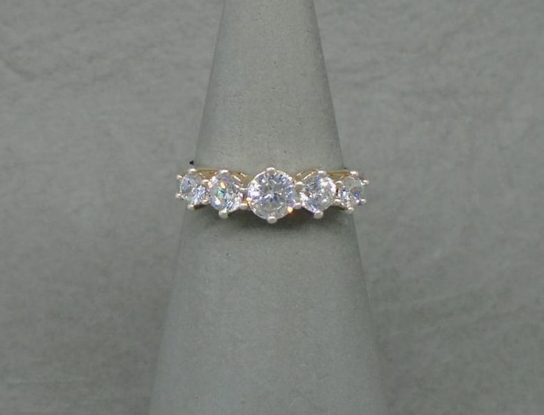 Gilt sterling silver ring with graduated stones
