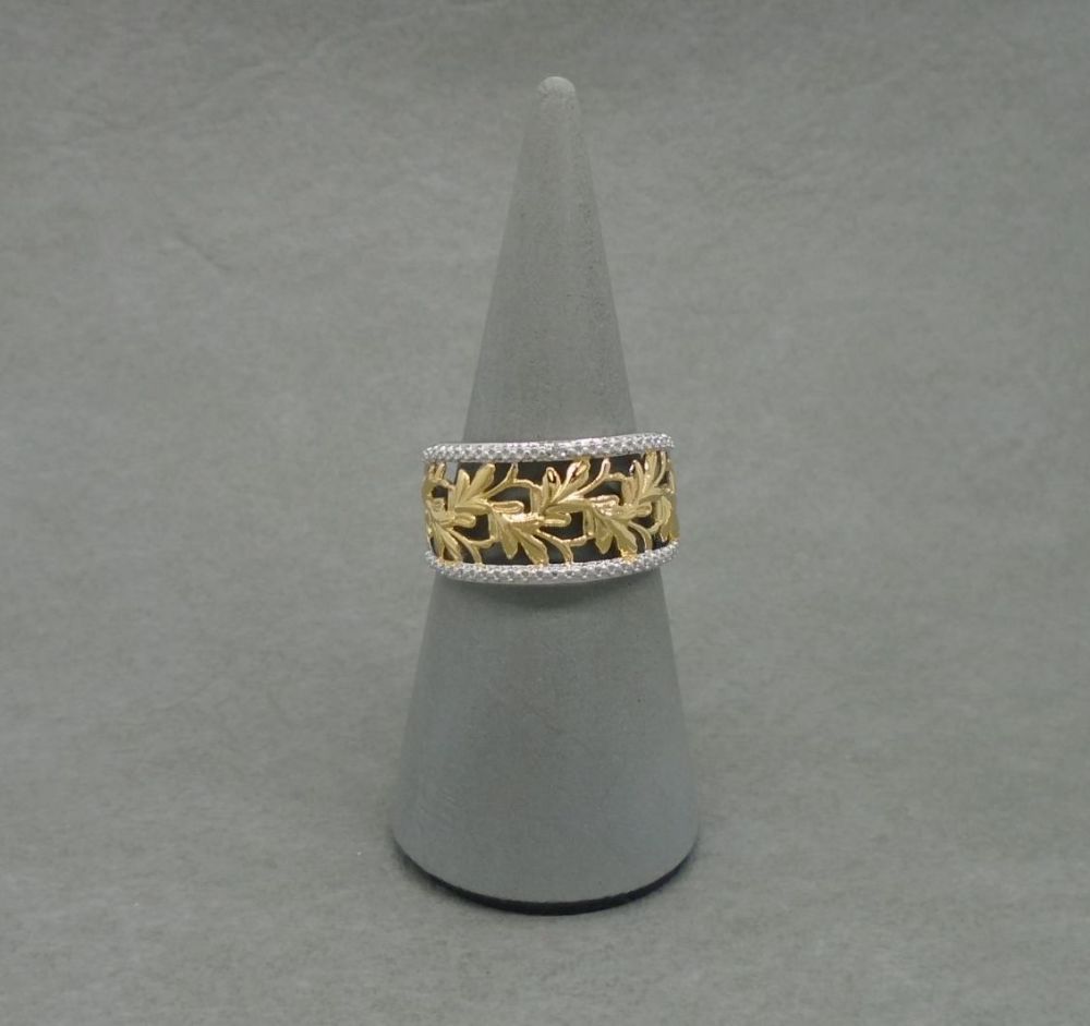 Wide fronted sterling silver ring with golden leaves