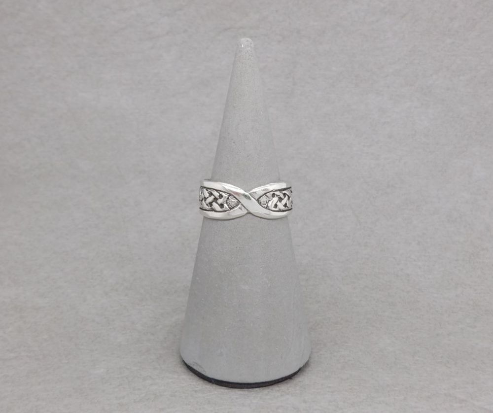 Adjustable sterling silver celtic thumb ring with a twist