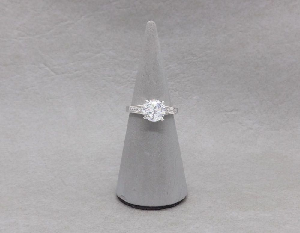 Sterling silver solitaire ring with accented shoulders