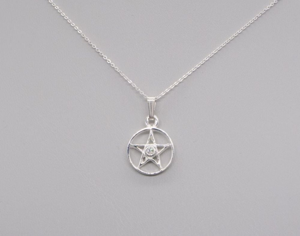 Small sterling silver pentagram necklace set with a clear stone