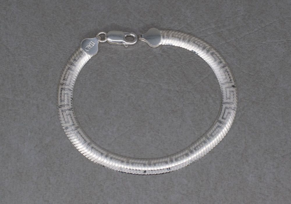 Sterling silver herringbone chain bracelet with a Greek key design