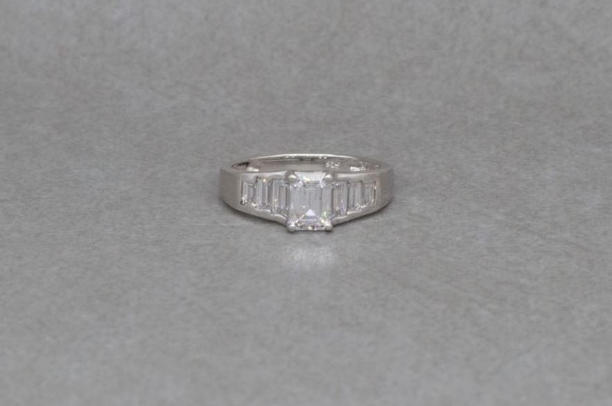 Sterling silver ring with graduated clear rectangular stones