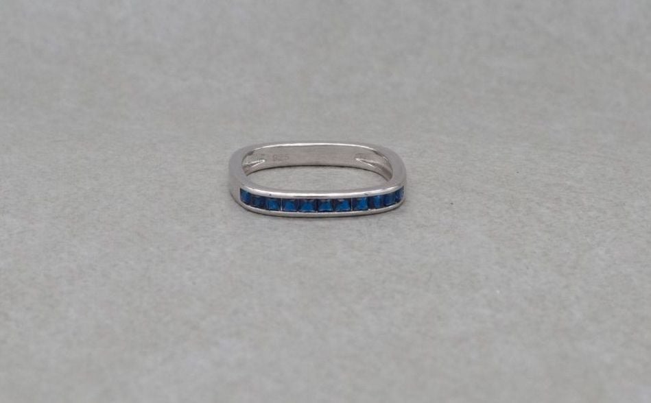 Unusual square sterling silver ring with deep blue stones