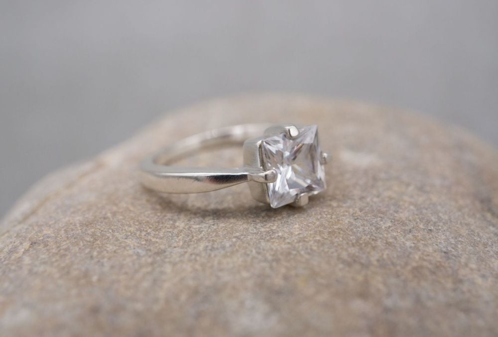 Square sterling silver solitaire ring with pinched shoulders