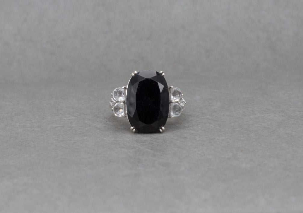 Substantial sterling silver ring with black & clear stones