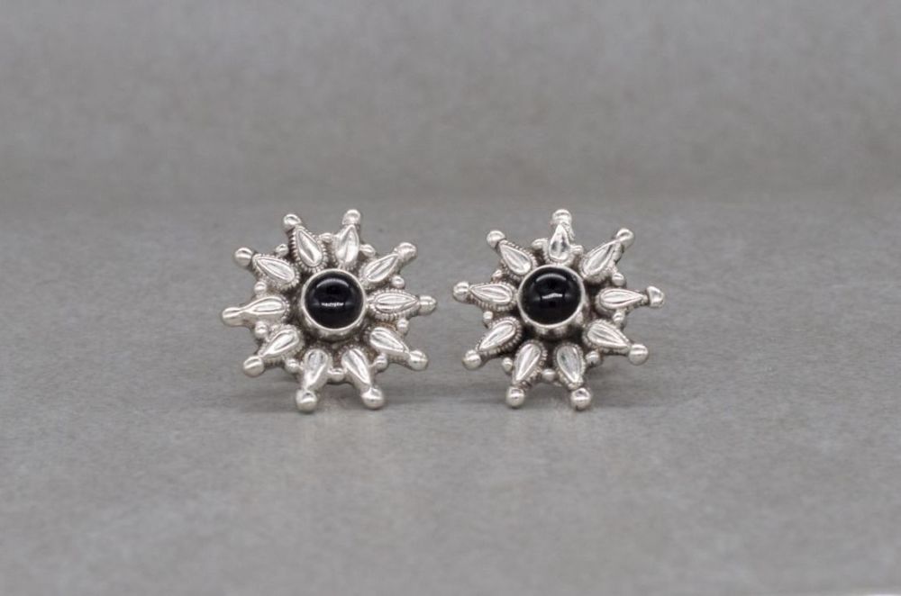 Sterling silver starburst stud earrings with black stone centre