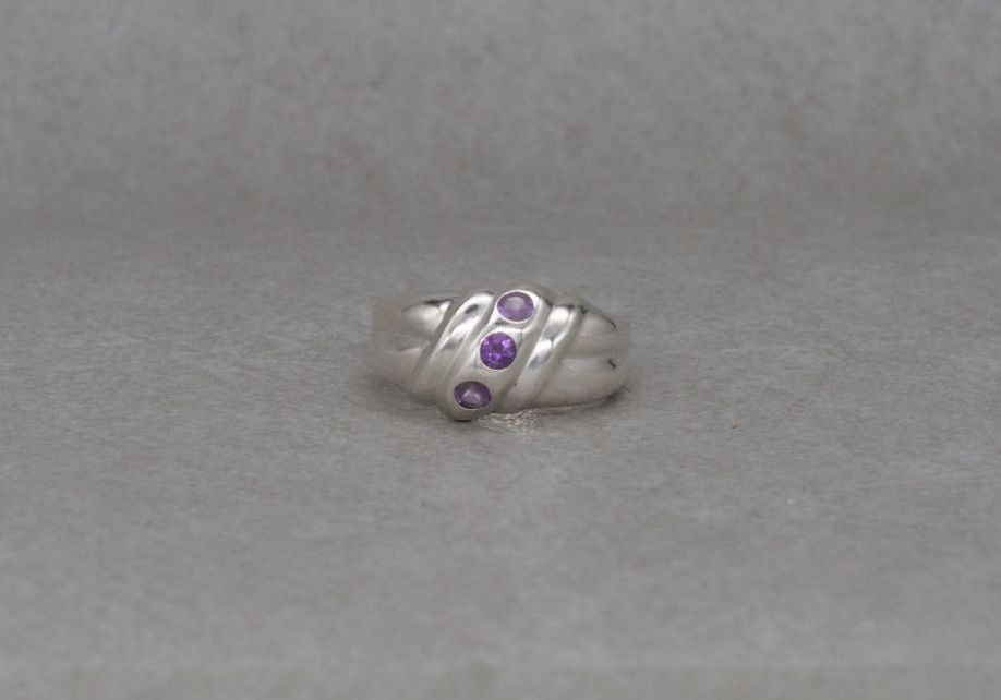 Sterling silver domed ring with purple stones