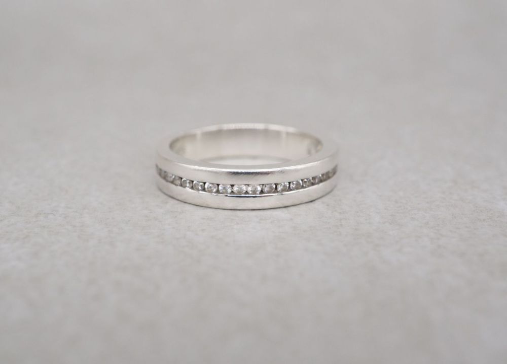 Thick set sterling silver & clear stone half eternity ring