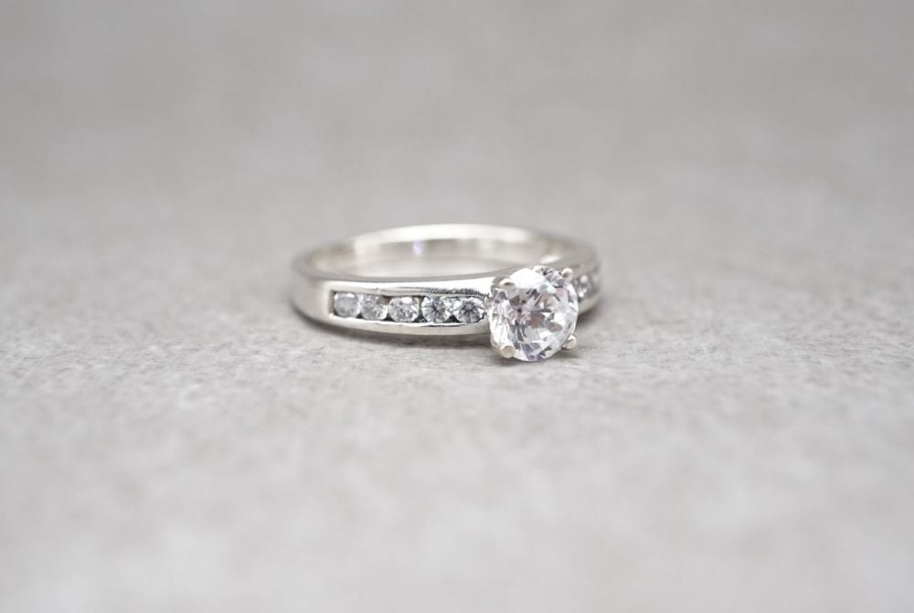 Sterling silver solitaire ring with accented shoulders