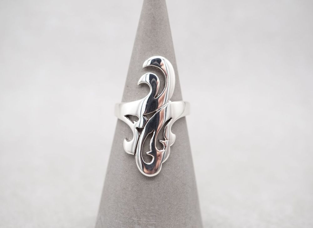 Wide sterling silver ring with a thick scroll design