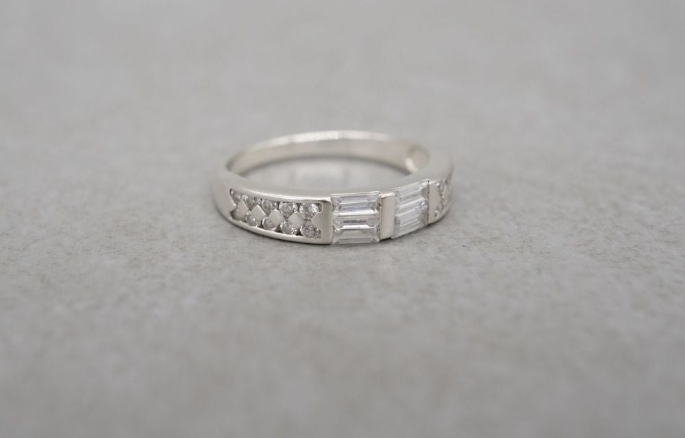 Slim sterling silver ring with multi-cut stones