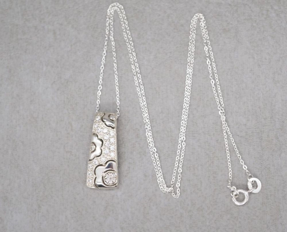 Sterling silver necklace with a floral design and clear stones