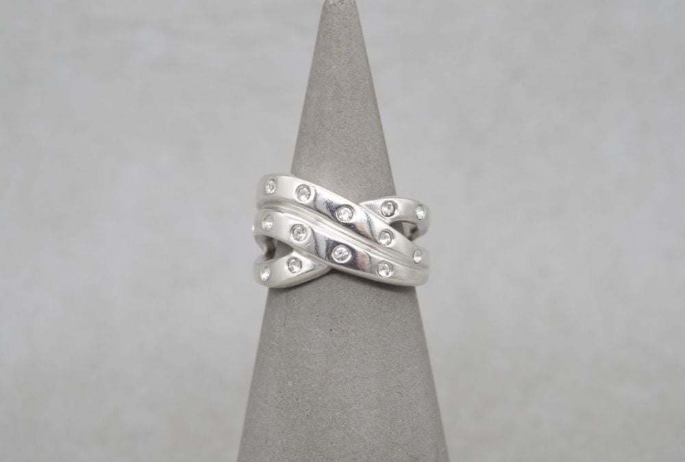 Chunky sterling silver cross-over ring with clear stones