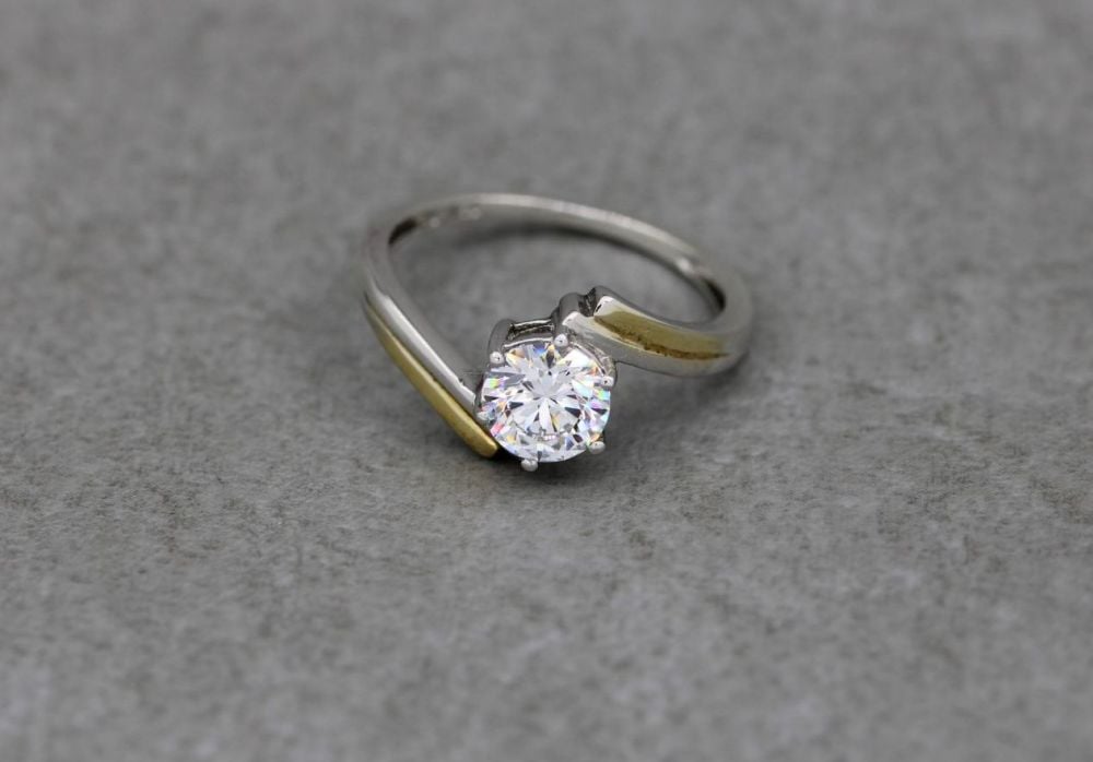 Sterling silver solitaire ring with gilt shoulder highlights