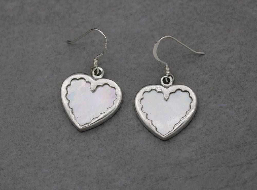 Sterling silver framed mother of pearl heart earrings