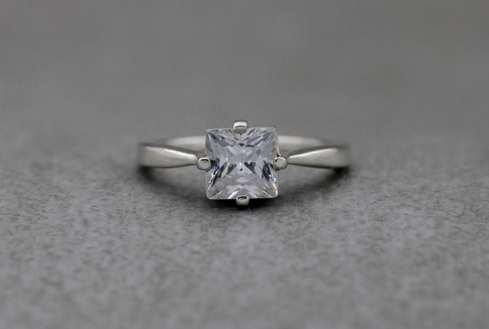Square sterling silver solitaire ring with pinched shoulders