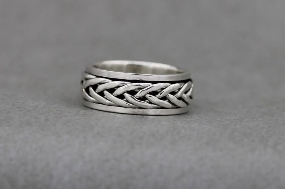 Sterling silver spinner ring with a woven band