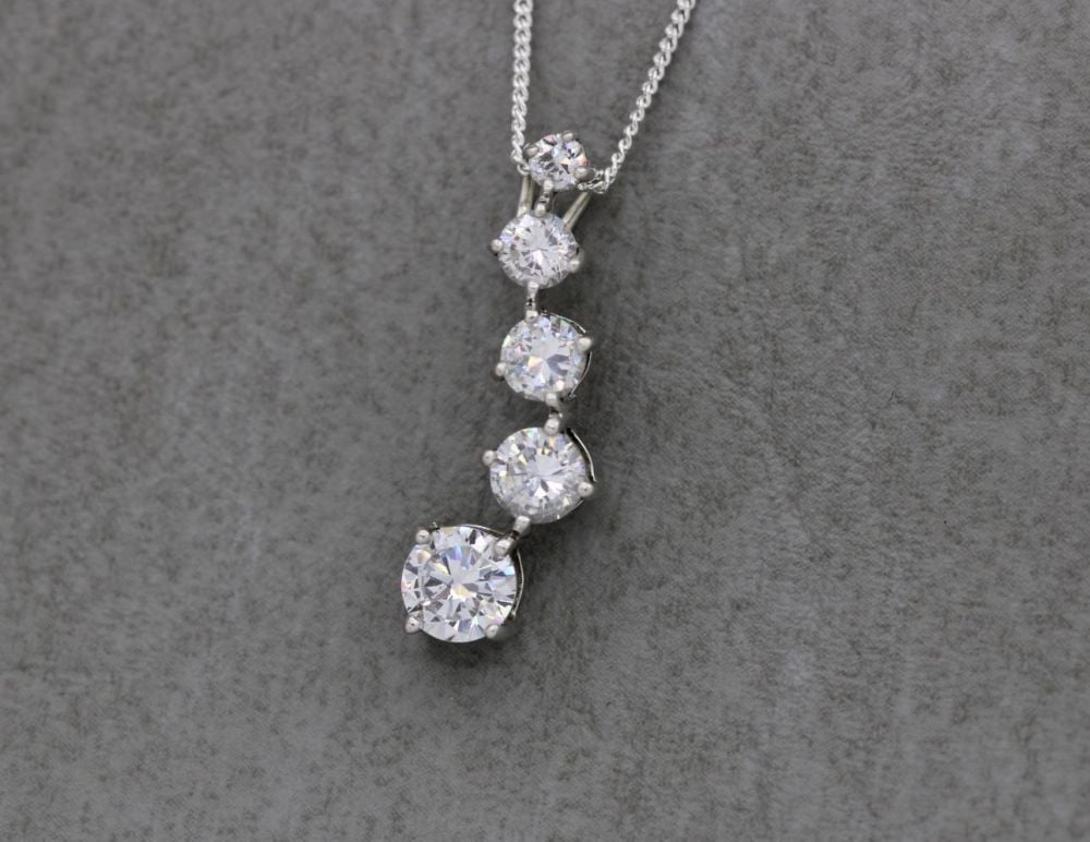 Sterling silver necklace with graduated clear stones