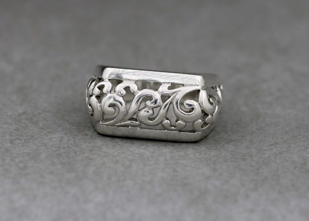 Fancy bold sterling silver ring with a scroll design