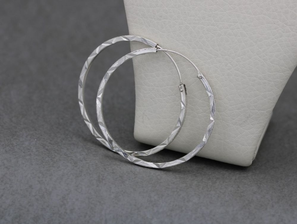 Sterling silver textured hoop earrings