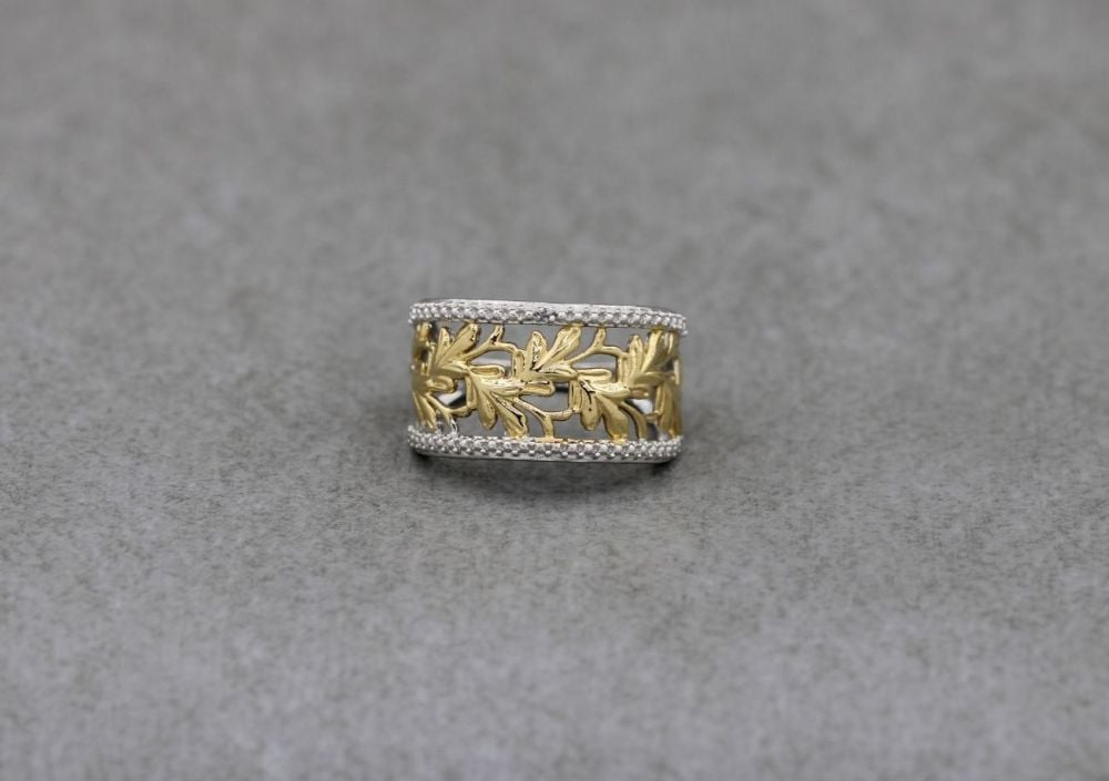 Fancy sterling silver ring with golden leaf detail (M 1/2)