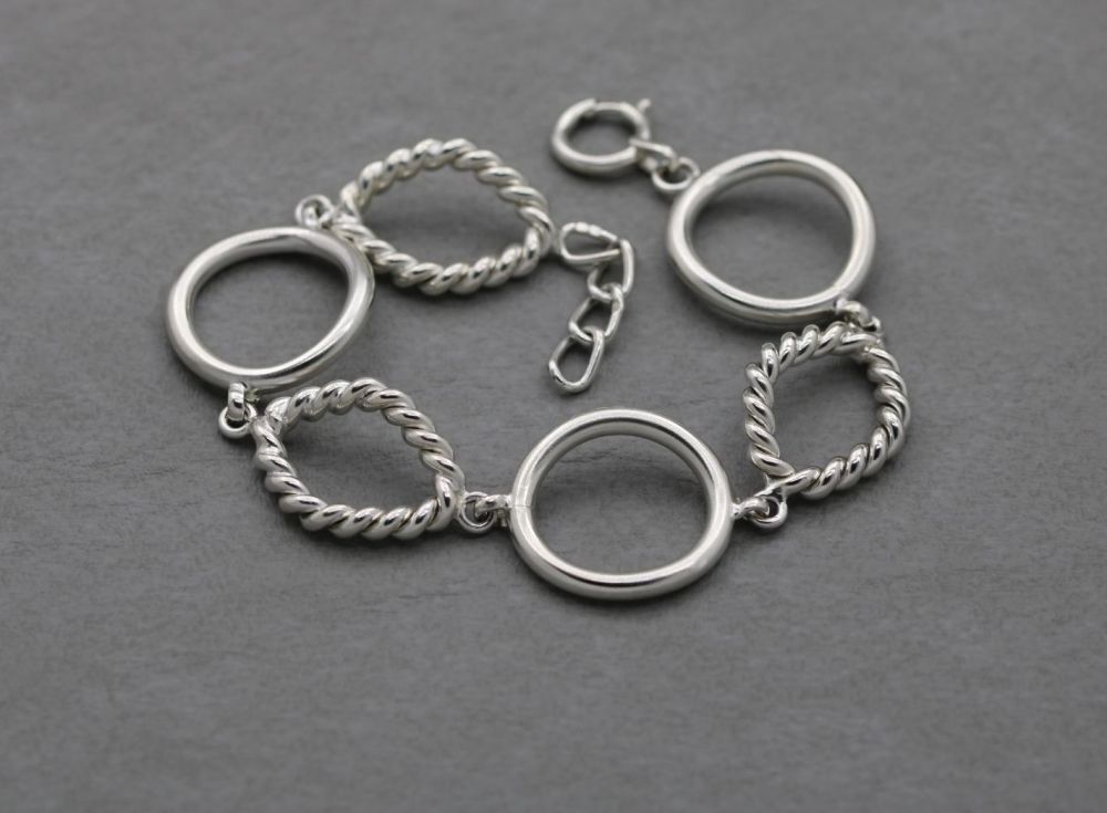 Heavy wide sterling silver bracelet with twisted detail