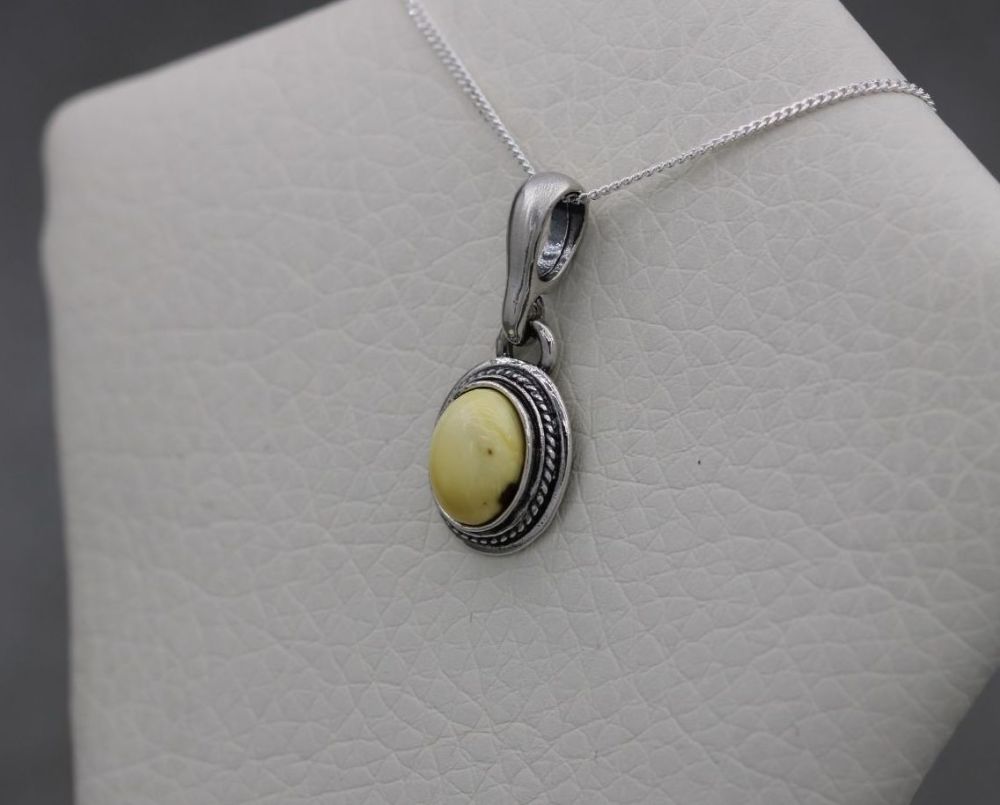 Small oval sterling silver & creamy lemon amber necklace