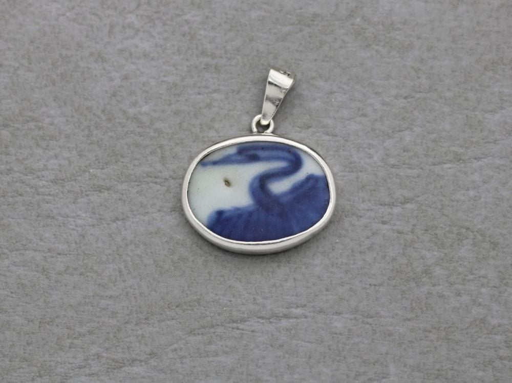 Sterling silver framed blue & white ceramic pendant