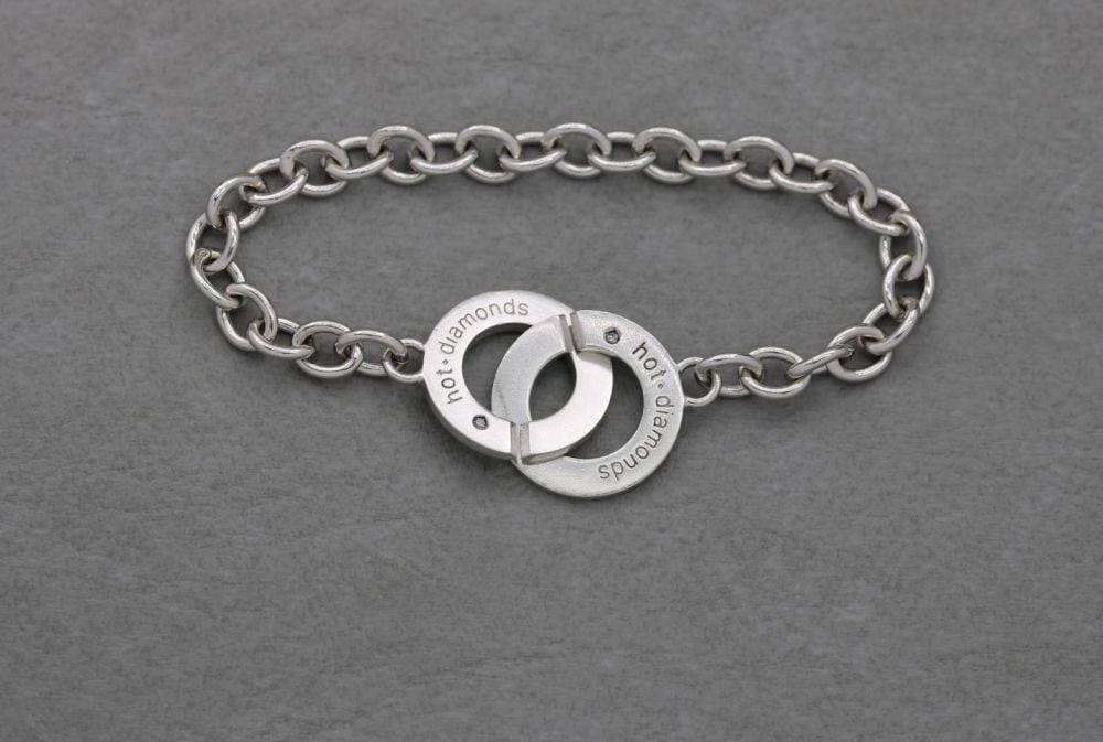 Sterling silver & diamond bracelet with an interlock clasp