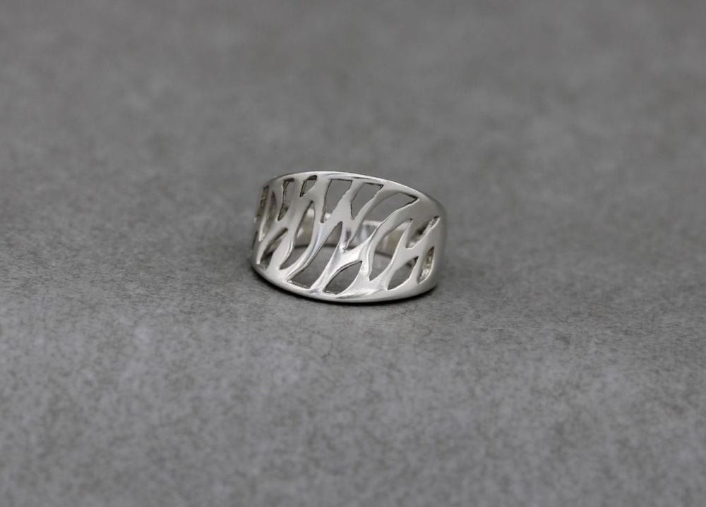 Sterling silver anticlastic ring with a cut out design