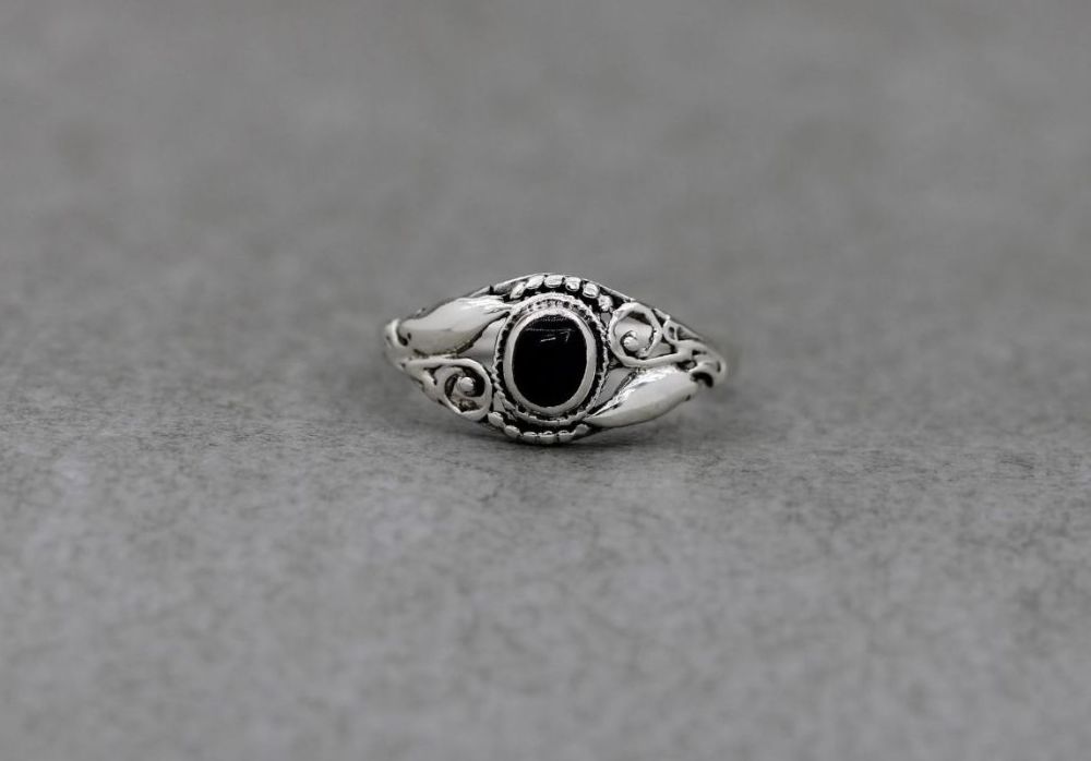 Sterling silver & black onyx ring with scroll & dot shoulders