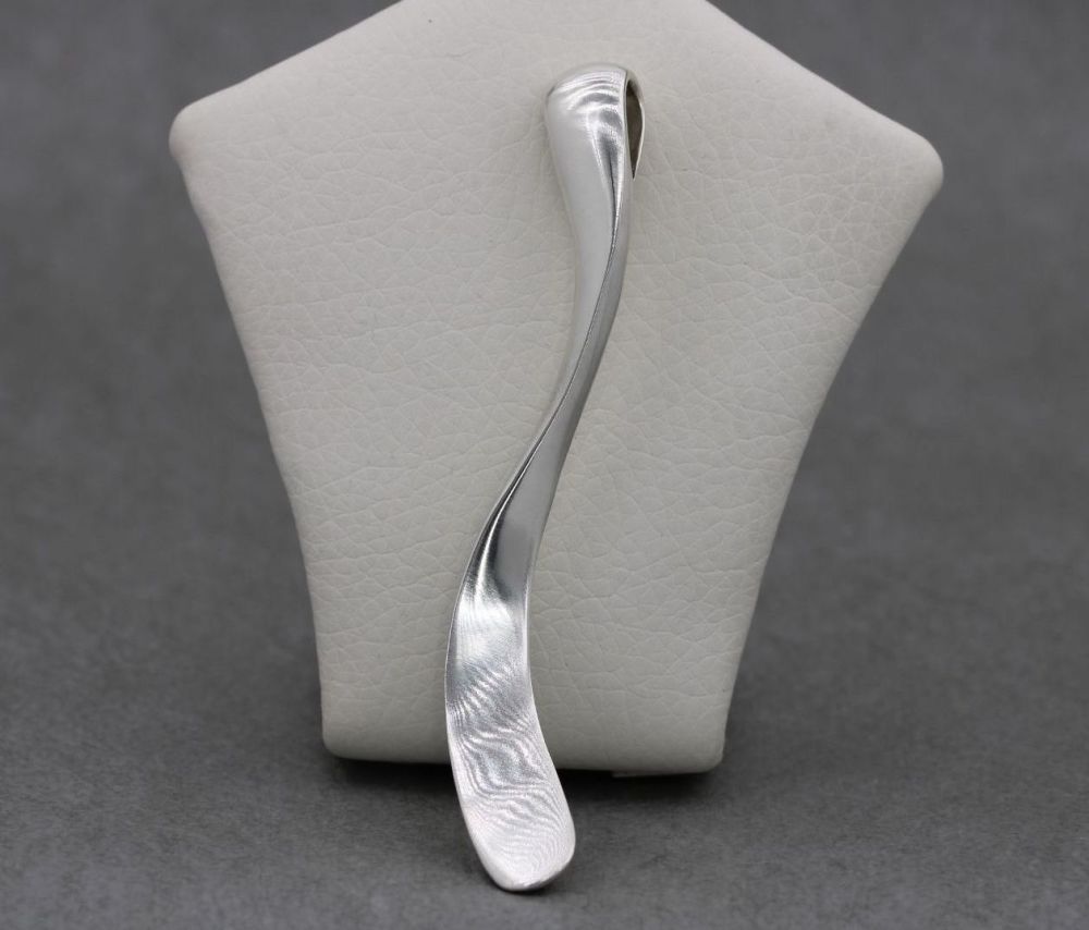 Long & sleek sterling silver gently twisted pendant