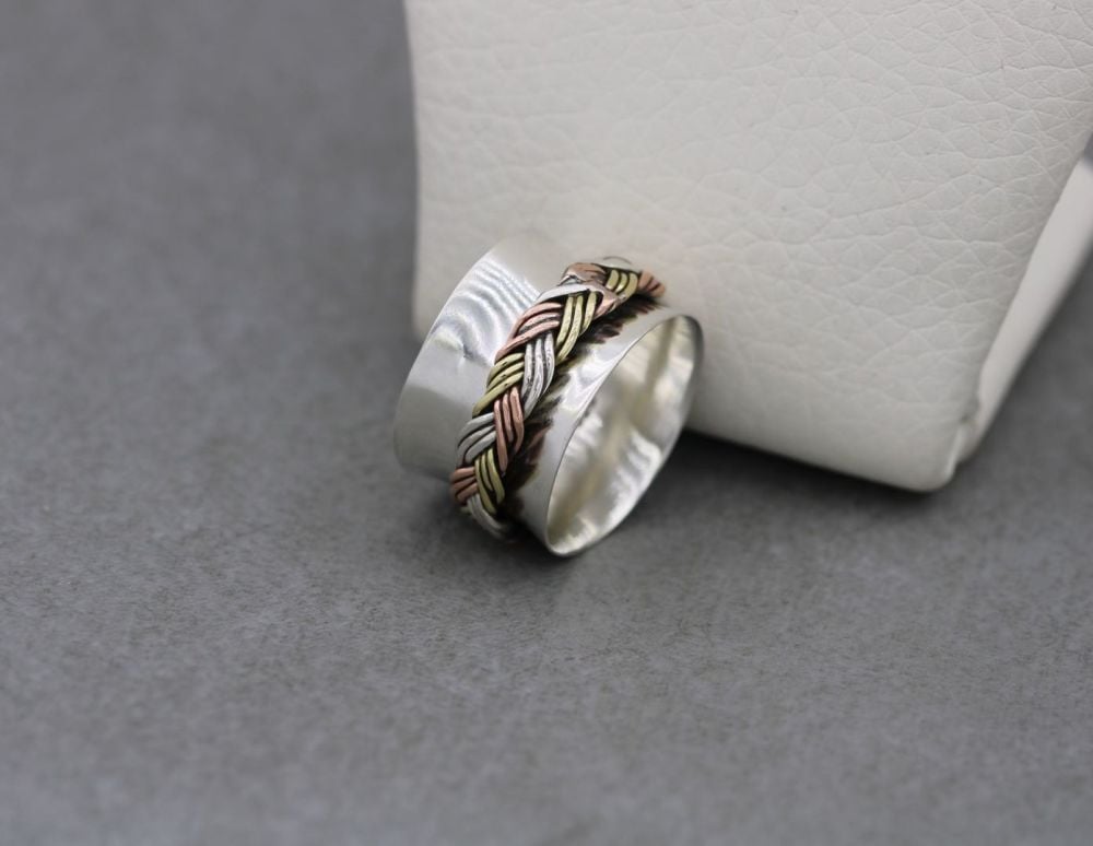 Handmade sterling silver spinner ring with a woven centre band