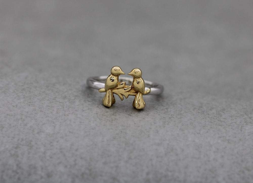 Sterling silver ring with two golden birds